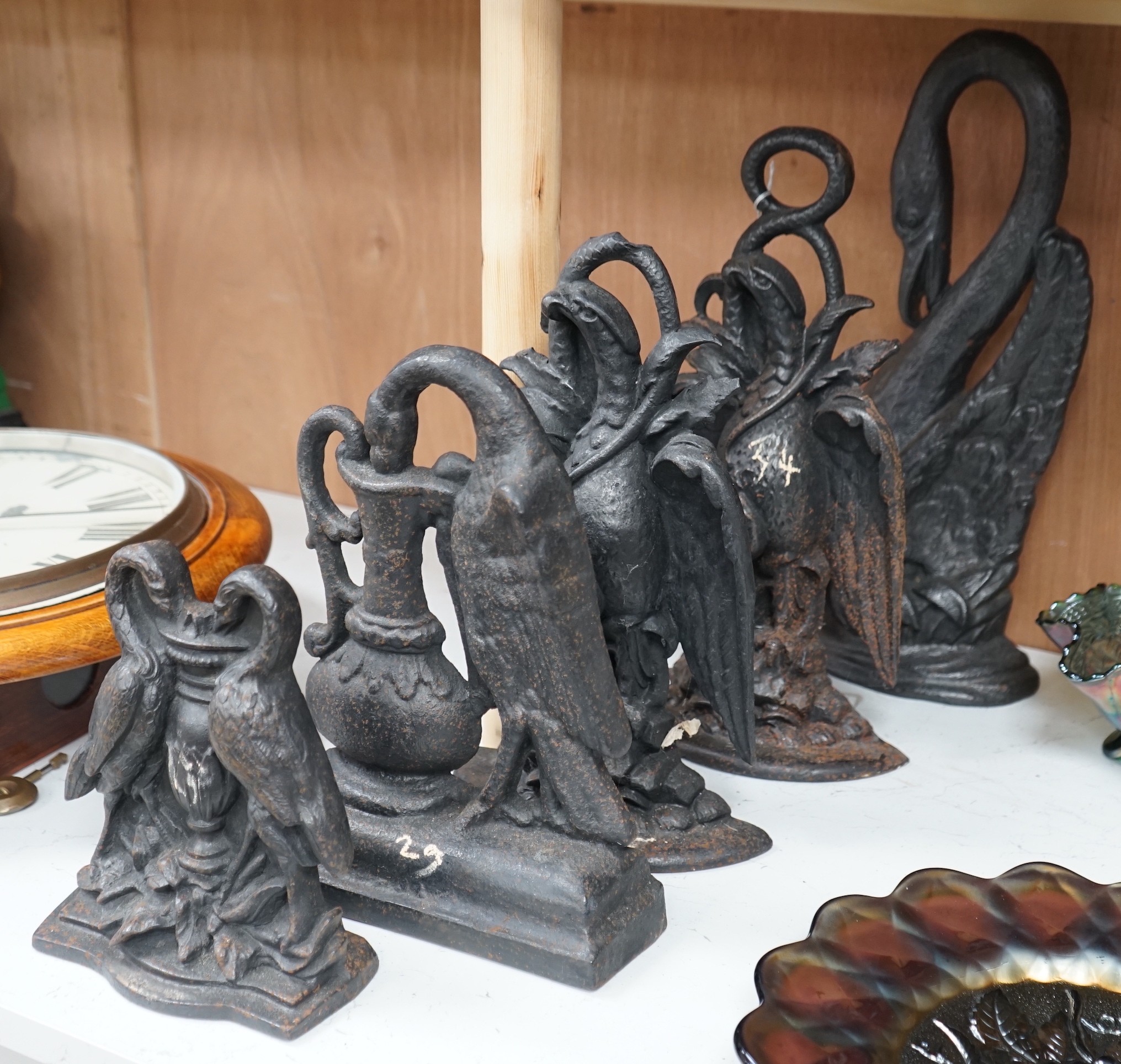 Five assorted cast iron bird designed doorstops, tallest swan 40cms high